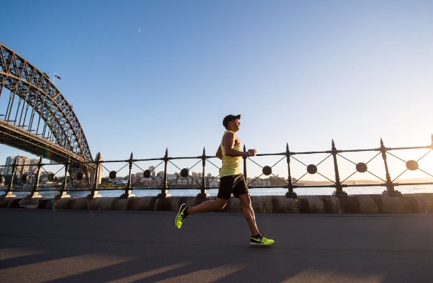 Person running along a river